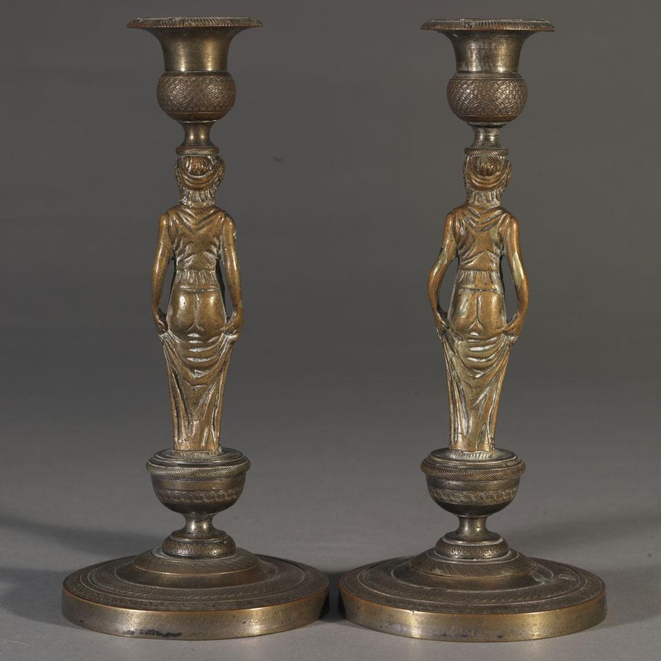 Pair of French Restauration Silvered Bronze Figural Candlesticks, early 19th century